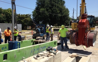 pipeline contractors facilitating a line stop service on a construction site